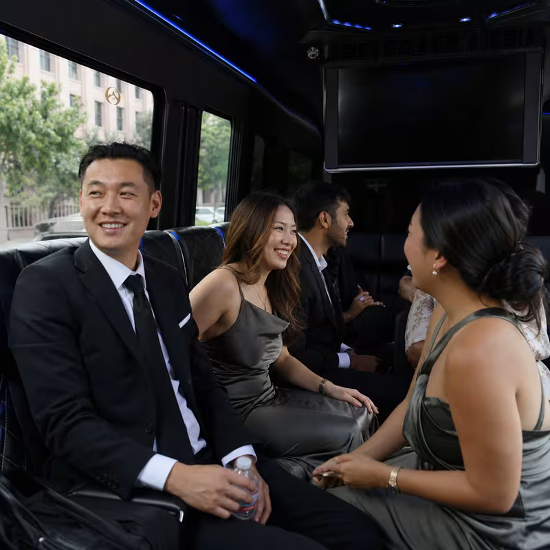 Wedding guests seated inside a Fremont party bus