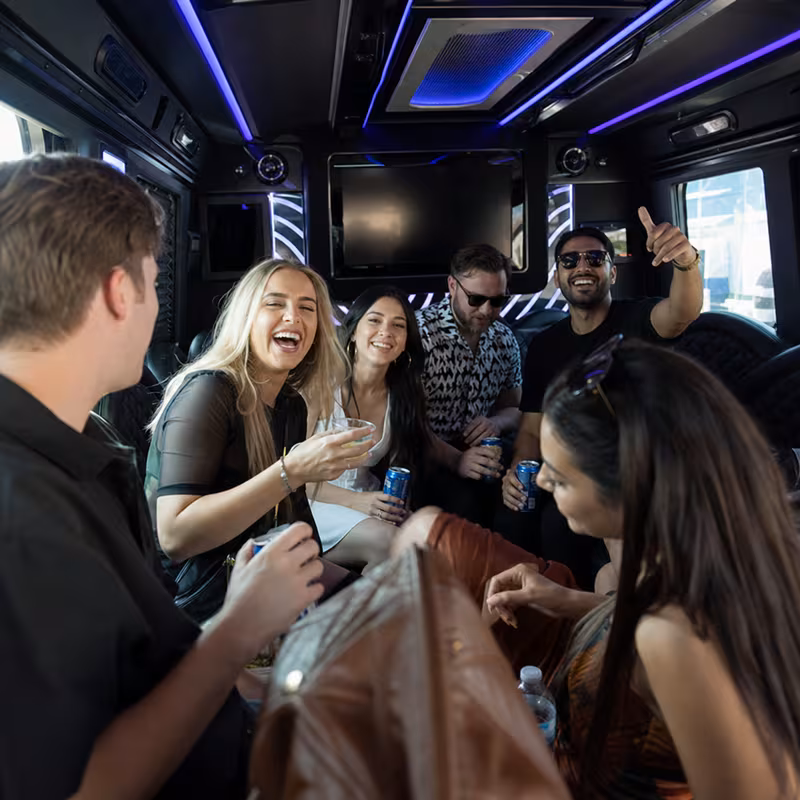 Passengers loading luggage while boarding an Fremont group shuttle
