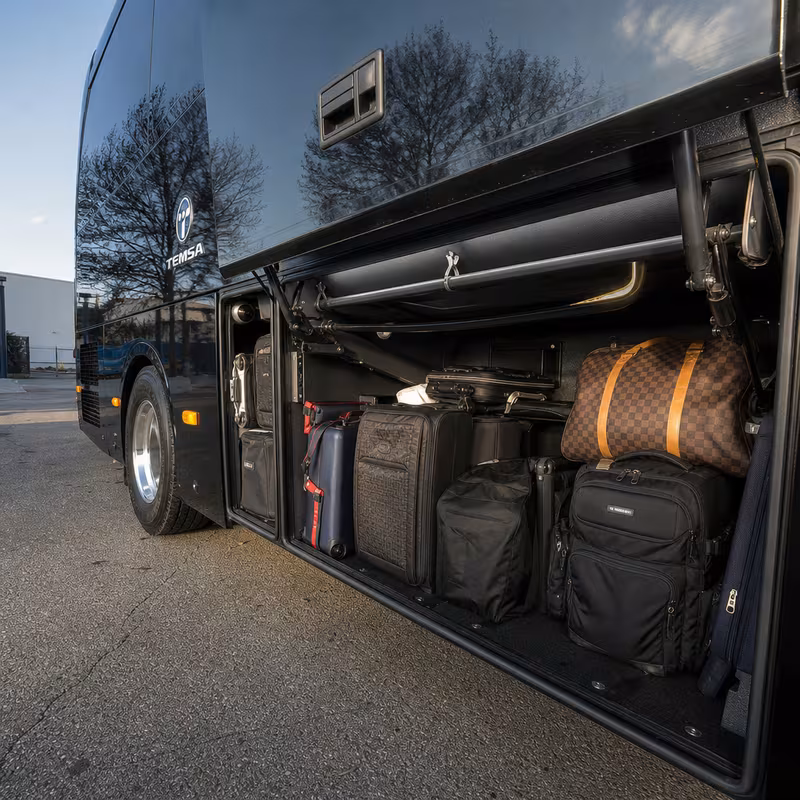 Party bus interior with wraparound leather seating and LED lighting in Fremont