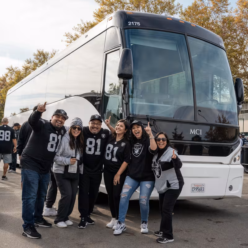 Passengers loading luggage while boarding an Fremont group shuttle