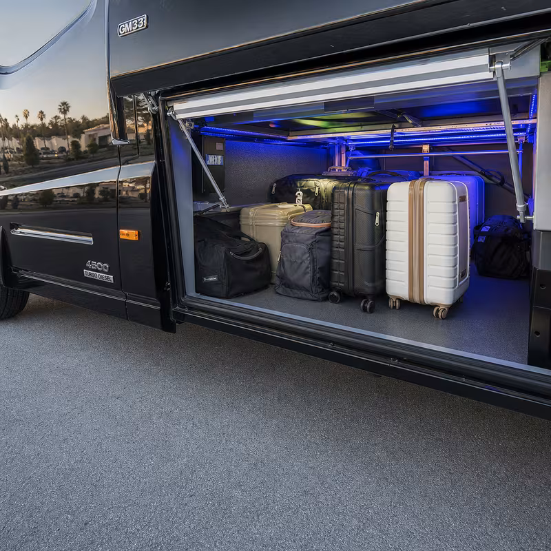 Party bus interior with wraparound leather seating and LED lighting in Fremont