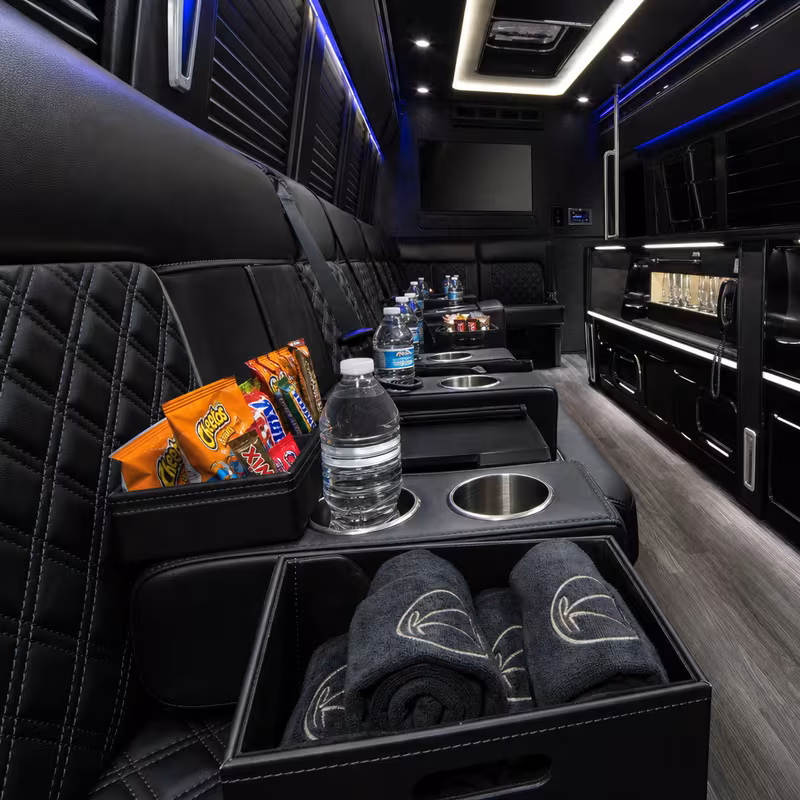 Party bus interior with wraparound leather seating and LED lighting in Fremont