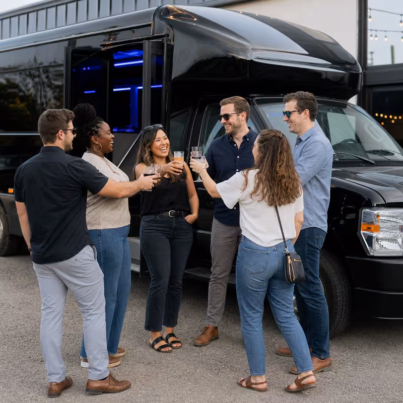 Passengers loading luggage while boarding an Fremont group shuttle
